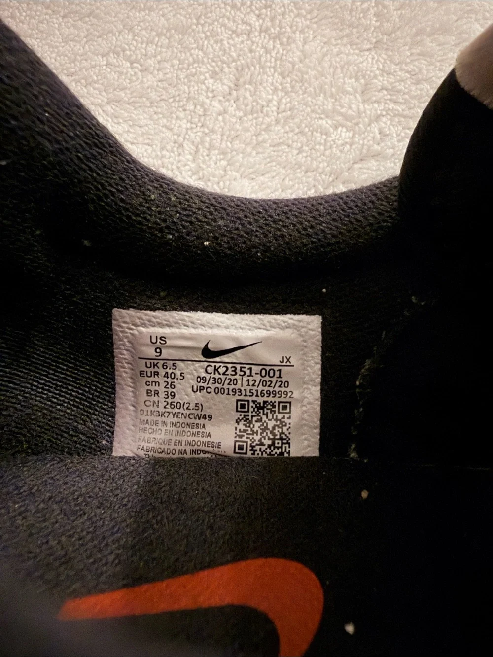 Nike Women’s Black Sneakers with White and Orange Accents